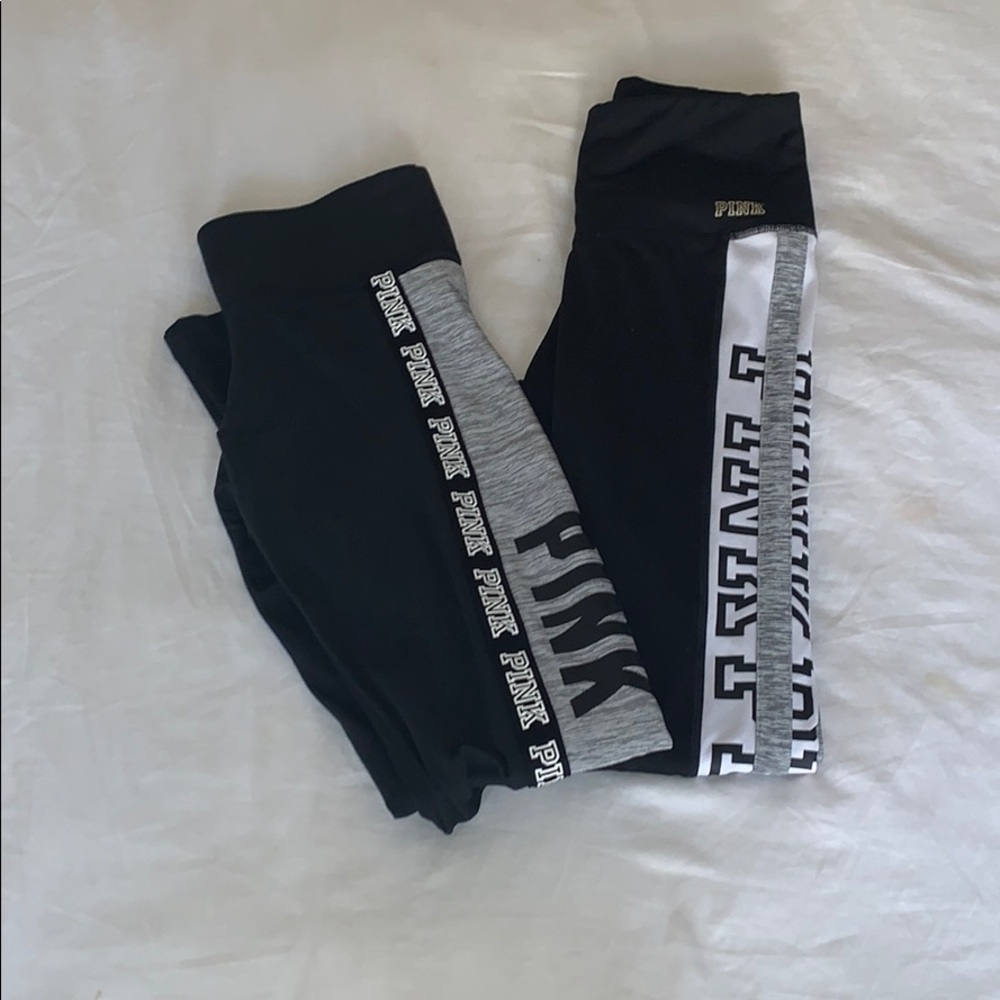 two pairs of PINK Victoria Secret leggings.